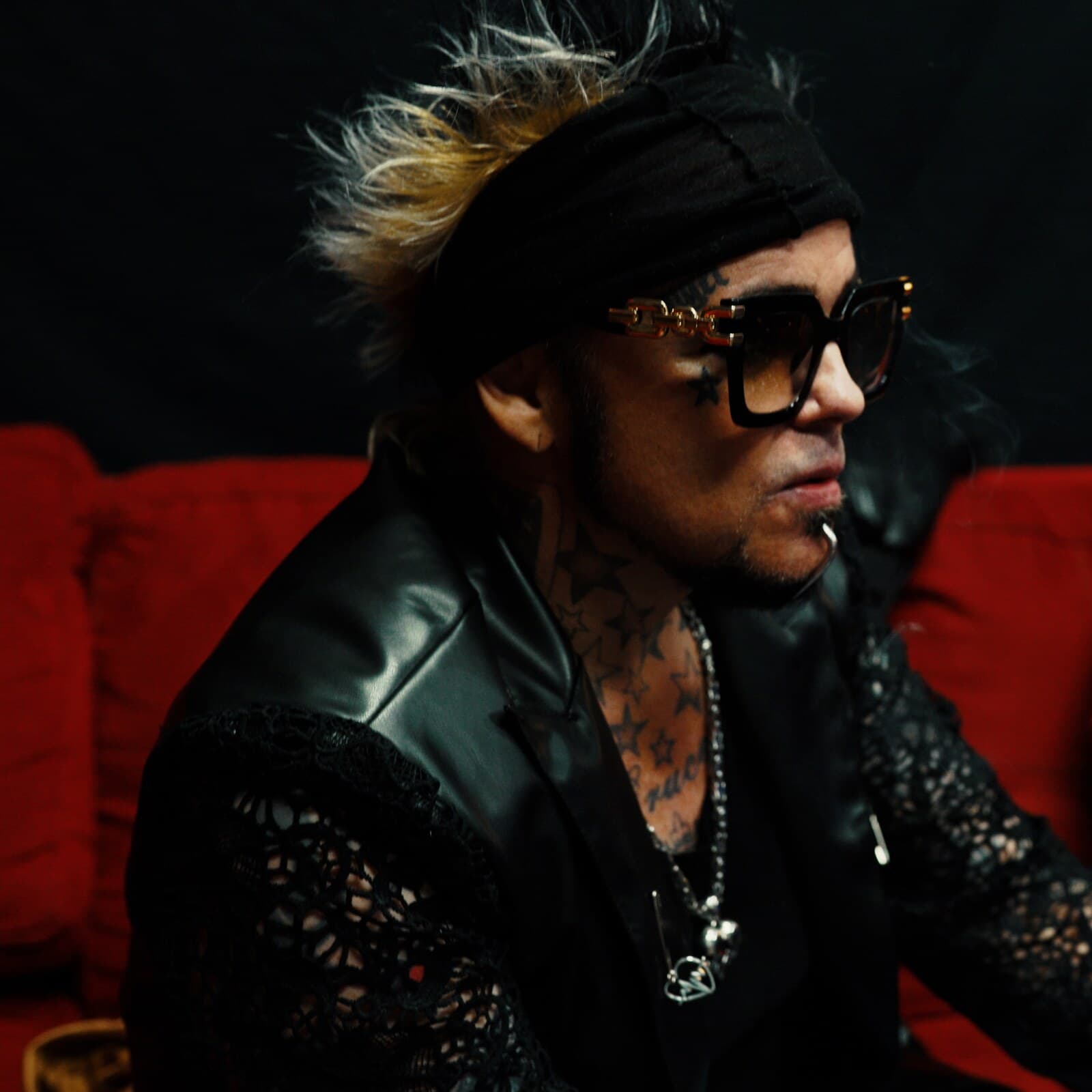 Lukas Rossi — red couch portrait
